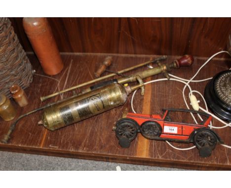 A VINTAGE FIRE EXTINGUISHER, AIR PUMP, CAST CAR DOOR STOPPER ETC. (5)