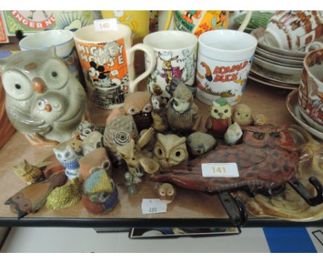 A selection of wise owls of different themes and styles ceramic, wood, cloisonne etc