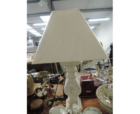 A modern style table top lamp with treen style body and matching shade