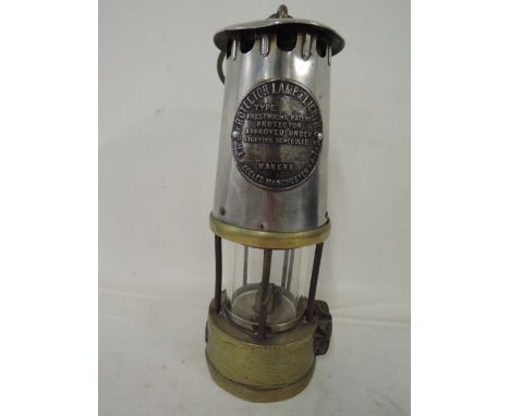 A vintage brass bottom coal miners Protector lamp by Prestwich Eccles Manchester