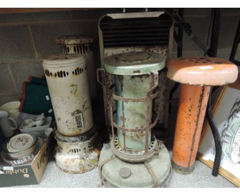 A selection of vintage metal and enamel paraffin heaters ideal upcycle rustic look lamps?