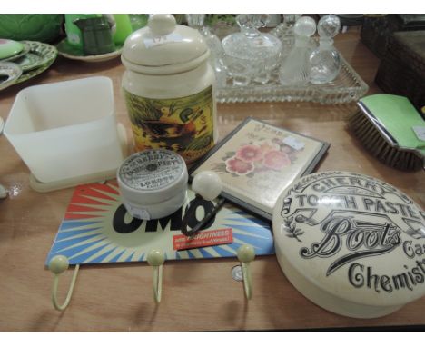 A selection of vintage advertising style containers and hooks
