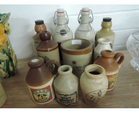A selection of vintage style advertising stoneware bottles and jar