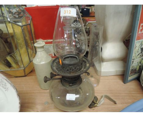A vintage Evered's no.2 oil burner lamp with glass well and brass fitments