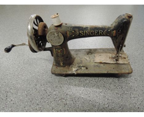Two vintage hand cranked sewing machines one by Willox & Gibb and a Singer 