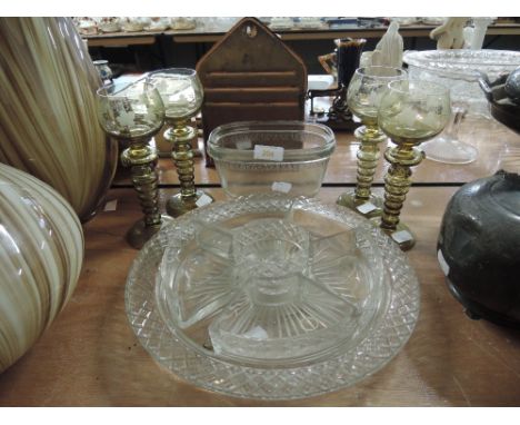 A selection of vintage green glass goblets and similar glass wares