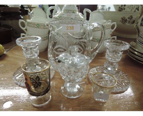 A selection of vintage cut and etched glass wares including water jug and candle stick set