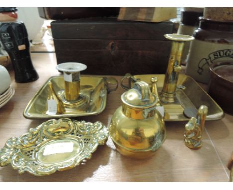 A selection of vintage brass wares including candle sticks and snuffers