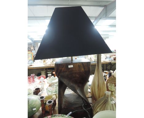 A large modernist style treen carved table lamp with twist form and matching shade as new