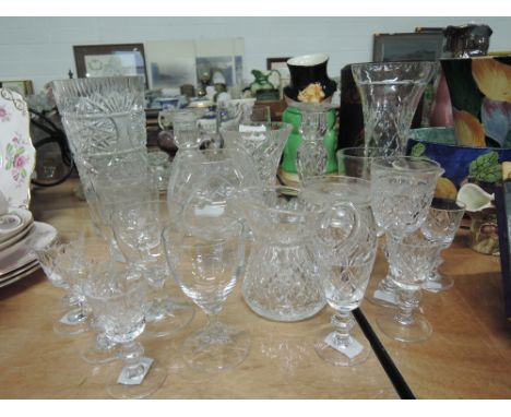 A selection of fine cut and etched glass wares including vase, candle stick etc