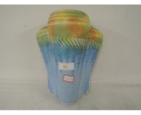 A vintage ceramic wall pocket with an Art Deco style 