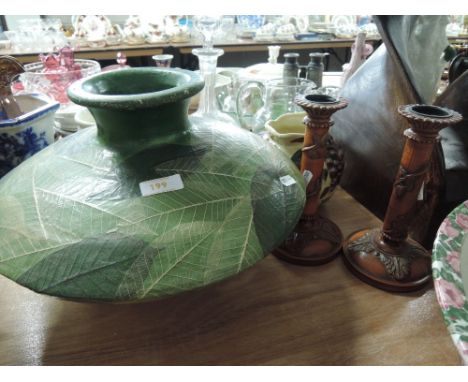 A large ceramic squat vase with foliate leaf decoration in a naturalistic finish