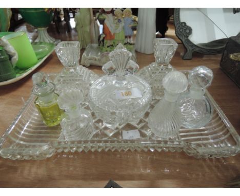 A vintage cut glass dressing table set and dish tray