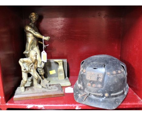 Miners helmet, brass mining figure and blacksmith