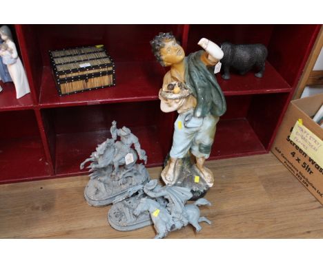 Plaster figure of a boy, 66 cm high, and pair of metal gate pillar ornaments men on horseback (all AF)