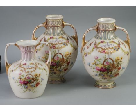 PAIR OF EARLY TWENTIETH CENTURY CONTINENTAL PORCELAIN TWO HANDLE OVOID VASES, the waisted necks united to the body with scrol