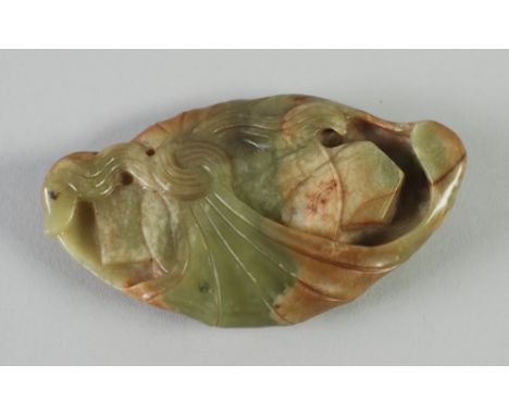 A CHINESE QING DYNASTY VARIEGATED GREEN AND RUSSET JADE CARVING of a precious object wrapped within a knotted cloth, 3 3/4" (