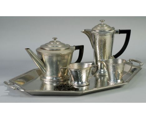 AN ART DECO PLANISHED SILVER PLATED PEWTER 'CRAFTSMAN' OBLONG OCTAGONAL TWO HANDLED TEA TRAY, TOGETHER WITH AN ASSOCIATED PLA