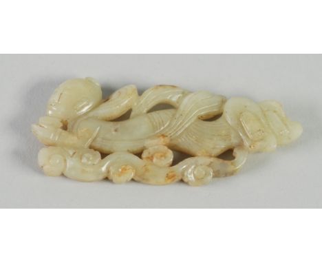 A CHINESE QING DYNASTY PALE GREEN JADE CARVING of a deity floating above cloud scrolls, 3 1/4" (8.4cm) long 