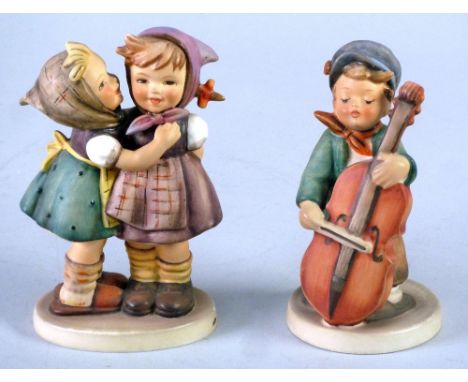 TWO GOEBEL POTTERY FIGURES, 'Telling her Secret' and 'Sweet Music', 5 1/2" (14cm) high, printed and impressed marks (2) 