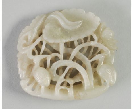 A CHINESE QING DYNASTY PALE CELADON JADE CARVING, pierced with two wading birds amongst lotus, 2 1/2" (6.3cm) across, 2 1/4" 