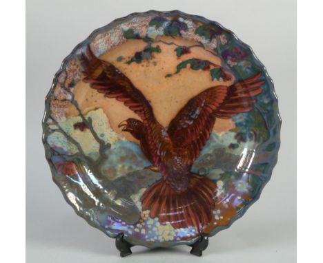 IMPRESSIVE GOUDA 'UNIQUE METALLIQUE' GLAZED POTTERY CHARGER, by Jan Van Schaik, of dished form with wavy rim, painted in colo