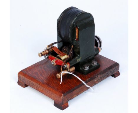 A well made model of a vintage Dynamo, raised on wooden plinth