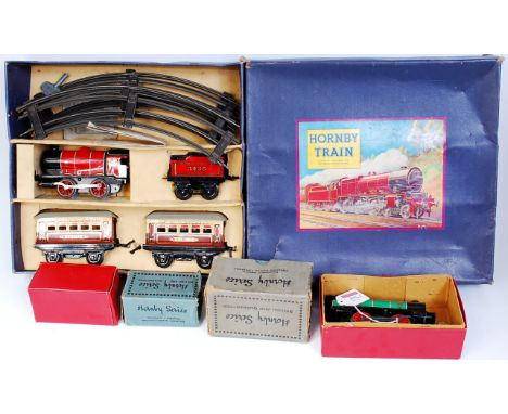 A Hornby M1 passenger set, some folds to cab on locomotive, Pullman coaches good for age, box lid split at corners (G-BD), so