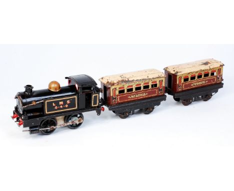 A Hornby clockwork No. 1 0-4-0 tank engine black LMS 0-4-0 on tank sides, in well played with condition (F) sold with 3 M1 Pu