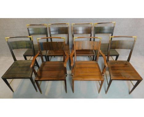 A set of eight 1970's vintage teak designer armchairs fitted brass caps and rails. H.85cm 