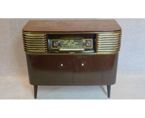 A 1960's vintage German radio and record player. 83x96x41cm (one leg loose) 