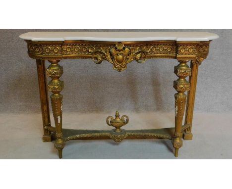 A 19th century Louis XVI style marble topped giltwood console table on reeded tapering supports united by undertier. 92x140x4