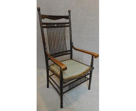 A late 19th century beech American style stick back armchair. H.83cm 