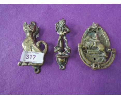 A selection of vintage brass cast door knockers Cornish imp and show jumper