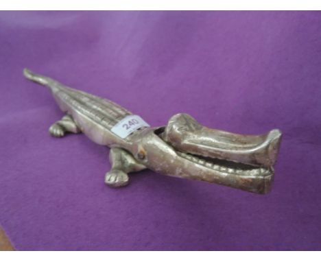 A vintage alligator nut cracker