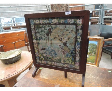 An early to mid 20th Century oak gateleg dining table and a folding fire screen