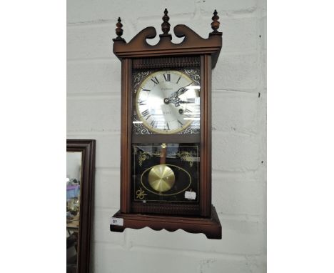 A vintage 31 Day Highlands wall mounted clock