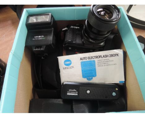 A box containing a Minolta X700 with MDZoom 35-70mm 1:3,5-4,8 lens and a Minolta auto 280PX flash unit, a Minolt autowinder D