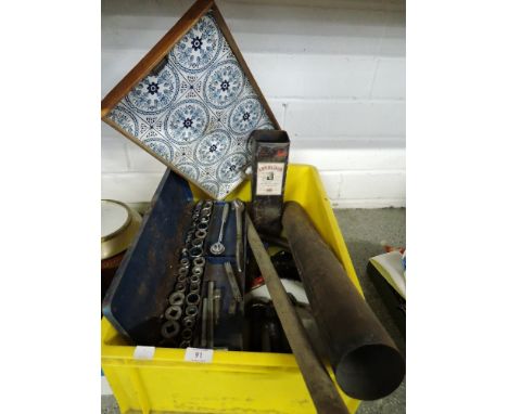 A selection of garage tools including socket set and large nut bolt set