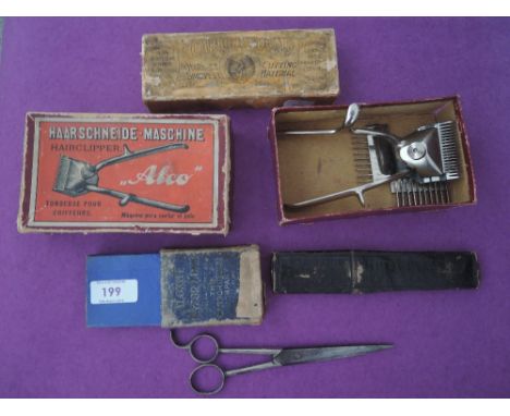 A selection of vintage barbers razor and other tools 