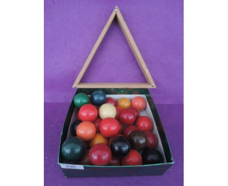 A set of miniature childrens size snooker balls and triangle 