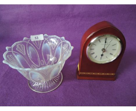 A vintage vaseline pressed glass bowl and small mantle clock