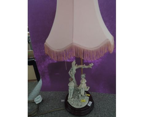 A vintage table lamp with figural base 