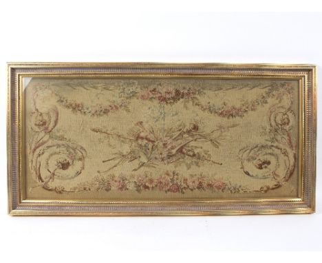 A needlework picture of Aubusson design, a wall mirror, a table with needlework top and a gilt brass cheval glass