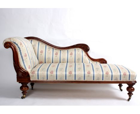 A Victorian scroll end sofa, with shaped back on turned legs, 149cm wide   Condition Report:  879 Slightly loose on frame and