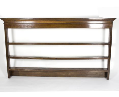 A 19th Century hanging shelf, with moulded cornice, 197cm wide