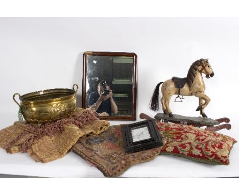 A group of miscellaneous items, to include a saddle bag, a mirror, a brass jardiniere and a wooden toy rocking horse 