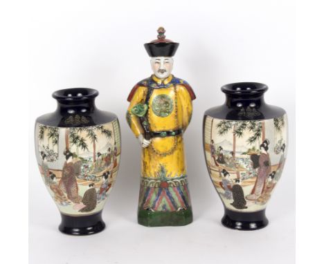 A pair of Japanese satsuma vases of baluster shape decorated with scenes of figures in gardens and interiors to a cobalt blue
