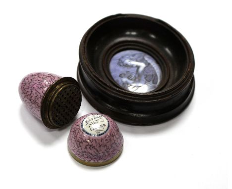 A South Staffordshire enamel egg-shaped nutmeg grater, with motto 'Esteem the Giver' to a lilac ground, 5cm long and an oval 