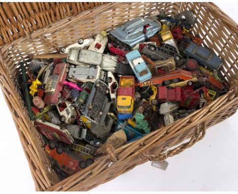 A quantity of Dinky and Lesney cars and similar, mid 20th Century and later, contained in a wicker hamper